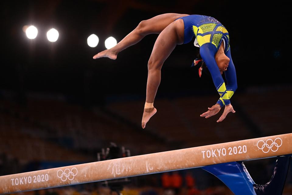 TOPSHOT - Brazil's Rebeca Andrade competes in the balance beam event of the artistic gymnastics women's all-around final during the Tokyo 2020 Olympic Games at the Ariake Gymnastics Centre in Tokyo on July 29, 2021. (Photo by Loic VENANCE / AFP) (Photo by LOIC VENANCE/AFP via Getty Images)