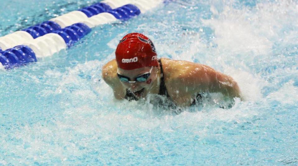 Charlotte Crush breaks her own state record in the 100-yard butterfly on Saturday morning in the girls state preliminaries. Tasha Poullard