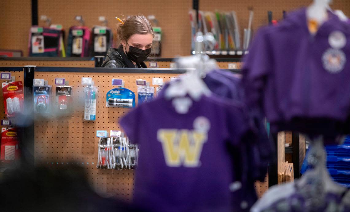 Abby Baker, a freshman from Burien, shops for class supplies at the University of Washington Tacoma Bookstore in downtown Tacoma, Washington, on Monday, Jan. 9, 2023. The Tacoma storefront is shifting operations to online only after Jan. 13.