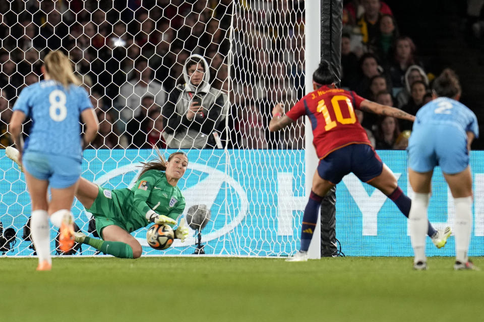 England's goalkeeper Mary Earps saves a penalty shot from Spain's Jennifer Hermoso , 2nd right, during the Women's World Cup soccer final between Spain and England at Stadium Australia in Sydney, Australia, Sunday, Aug. 20, 2023. (AP Photo/Abbie Parr)