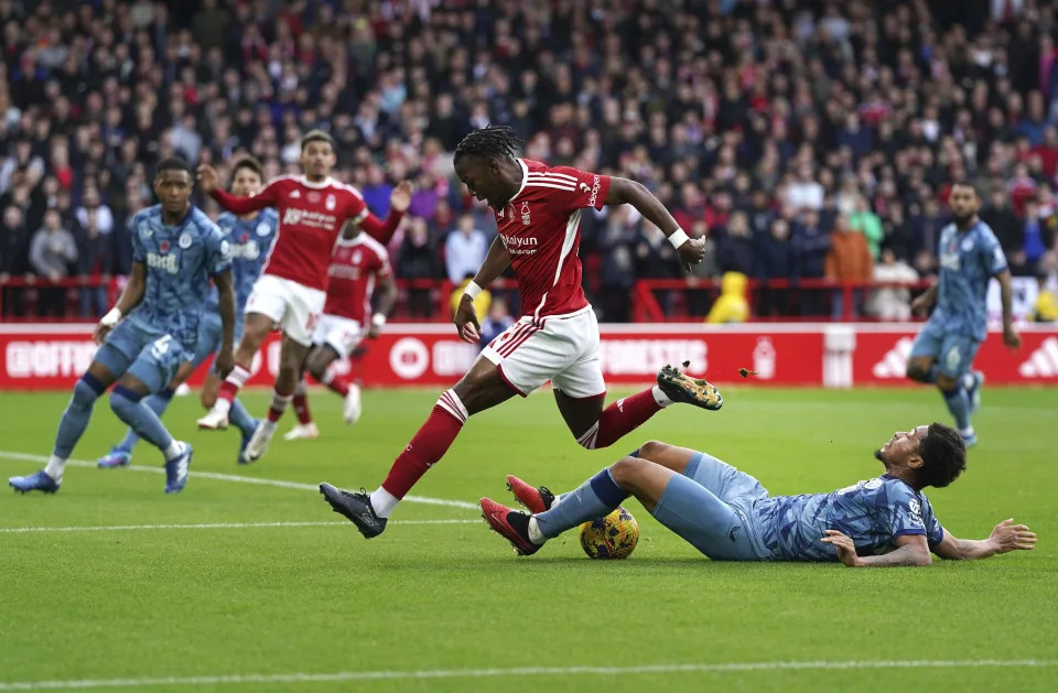 Aston Villa's Boubacar Kamara, right, tackles Nottingham Forest's Anthony Elanga during the English Premier League soccer match between Nottingham Forest and Aston Villa at City Ground, Nottingham, England, Sunday, Nov. 5, 2023. (Nick Potts/PA via AP)