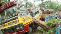 A bus damaged by a fallen tree due to Cyclone Amphan, is seen in Kolkata, India