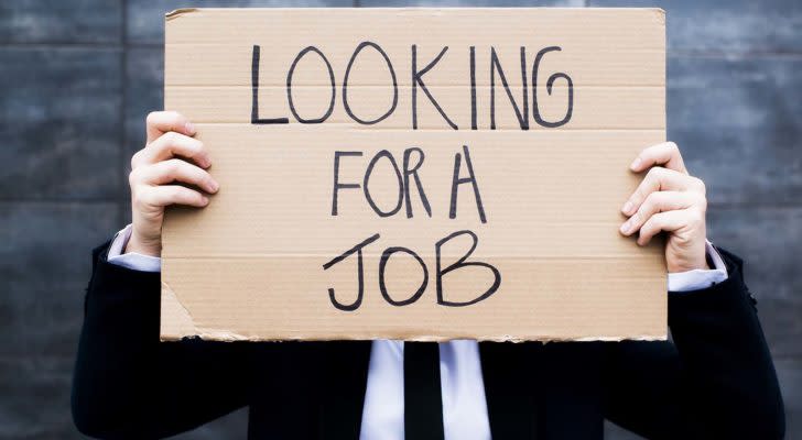 Man holding sign that reads &quot;Looking for a job&quot;