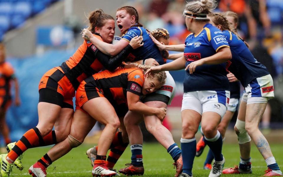 Leeds Rhinos' Dannielle Anderson (centre, blue) is grateful that she sought help after experiencing breast pain - Lee Smith/Reuters