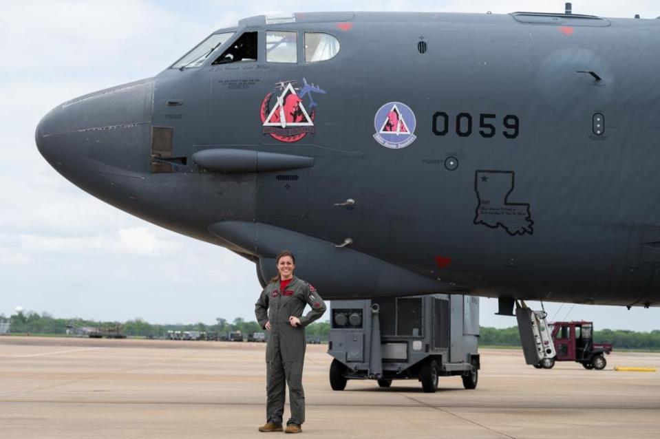 Lt Col. Vanessa Wilcox, incoming 96th Bomb Squadron commander, poses in front of a B-52H Stratofortress at Barksdale Air Force Base, Louisiana, April 21, 2022. Wilcox is the first female B-52 squadron commander in the Air Force.