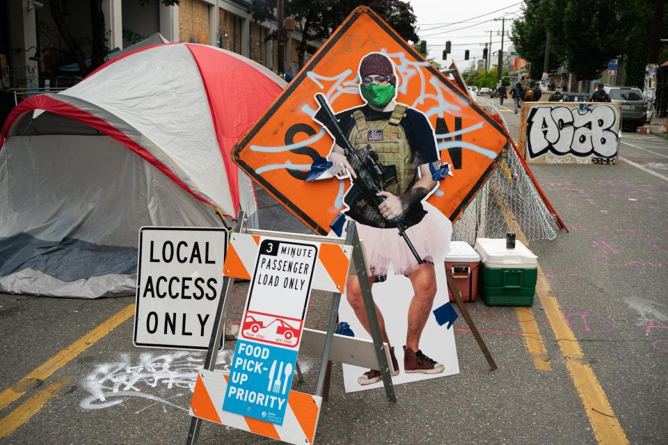 SEATTLE, WA - JUNE 29: A cutout image of a man holding a firearm, called "ANTI-FAiry" and created by activists to critique the recent manipulation and misleading use of the man's image by Fox News, is seen at an entrance in the area known as the Capitol Hill Organized Protest (CHOP) on June 29, 2020 in Seattle, Washington. Protesters resisted last week as city crews attempted to remove barriers from blocking the road. (Photo by David Ryder/Getty Images)