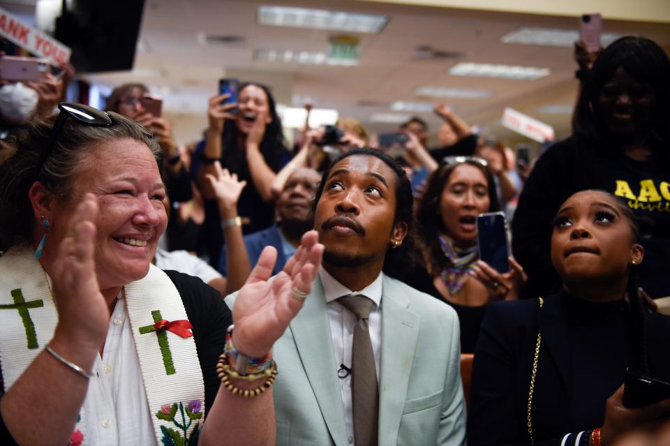 Justin Jones (center) reacts as the Metro Council votes to send him back to the House of Representatives on Monday after his expulsion last week.