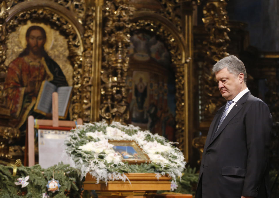 Ukrainian President Petro Poroshenko attends the service marking Orthodox Christmas and celebrating independence of Ukrainian Orthodox Church in the St. Sophia Cathedral in Kiev, Ukraine, Monday, Jan. 7, 2019. (AP Photo/Efrem Lukatsky)