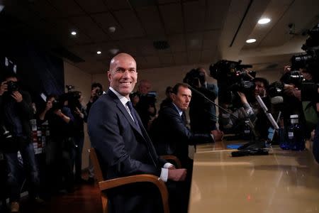 Real Madrid's new coach Zinedine Zidane reacts as he arrives to a news conference at Santiago Bernabeu stadium in Madrid, Spain, January 5, 2016. REUTERS/ Juan Medina