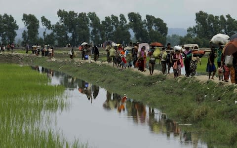 Rohingya Muslim refugees arrive from Myanmar - Credit: ASADK M ASAD/AFP/Getty Images