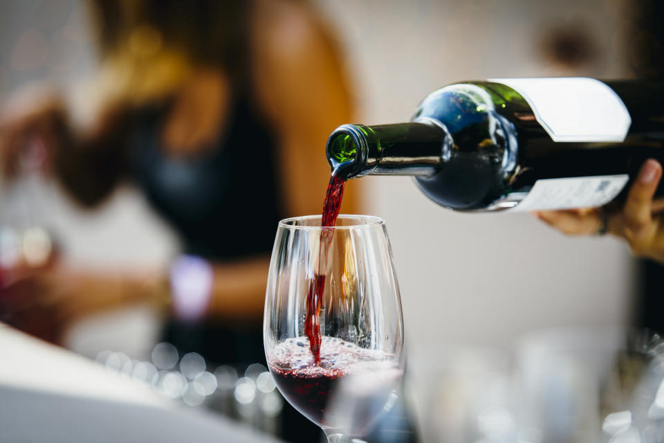 Red wine being poured into a glass