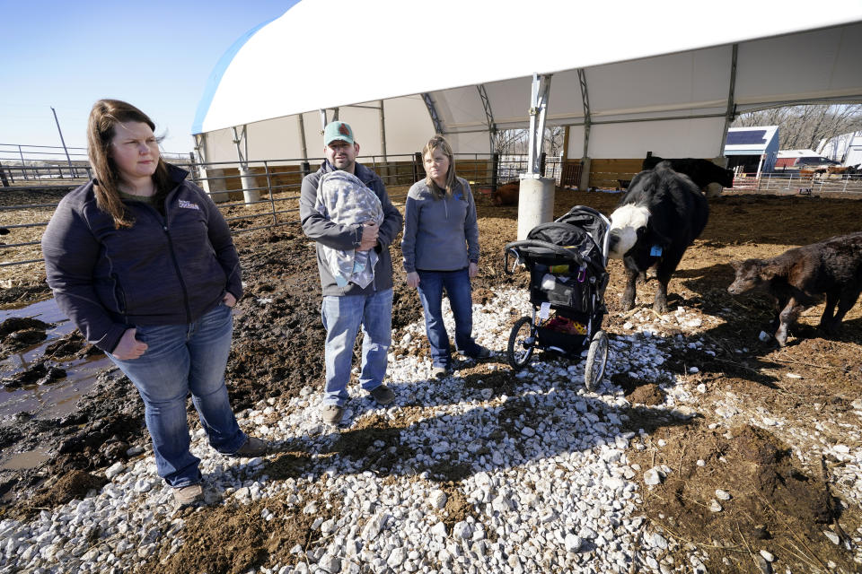 Vaughn Farms co-owners Jerilyn Hergenreder, left, Mat Vaughn and his wife Jalane Vaughn, talk about their specialty cattle operation, Tuesday, March 2, 2021, near Maxwell, Iowa. Sudden meat shortages last year because of the coronavirus led to millions of dollars in federal grants to help small meat processors expand so the nation could lessen its reliance on giant slaughterhouses to supply grocery stores and restaurants. (AP Photo/Charlie Neibergall)