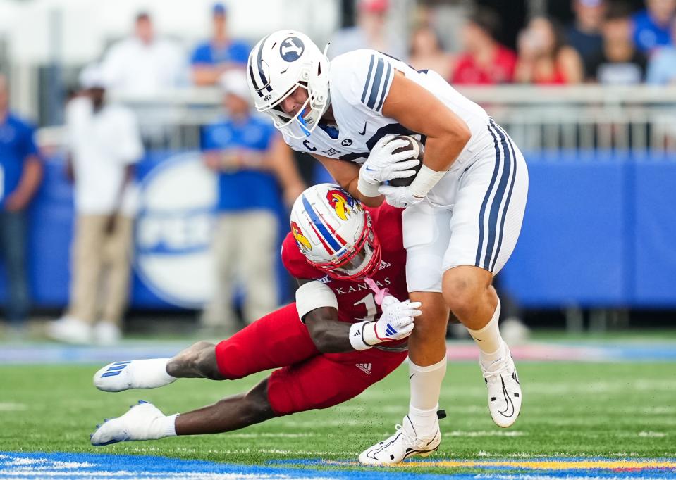 Kansas safety Kenny Logan Jr. tackles BYU tight end Isaac Rex during the Jayhawks' Big 12-opening win last week in Lawrence. Both Kansas and Texas enter Saturday's game in Austin nationally ranked and undefeated.