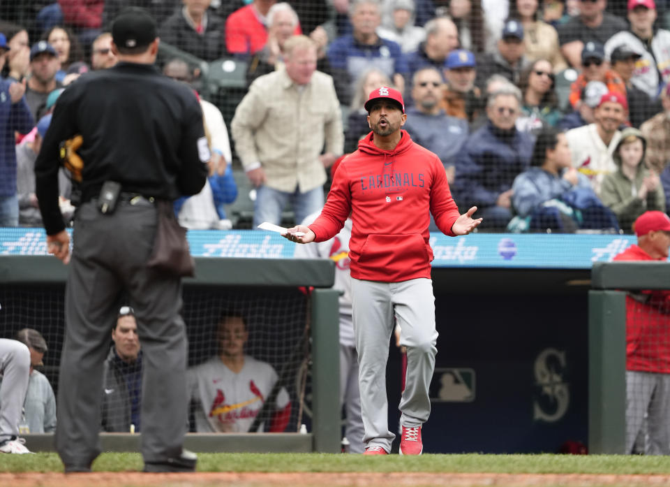 St. Louis Cardinals manager Oliver Marmol walks out of the dugout after designated hitter Willson Contreras was ejected for breaking his bat after striking out against the Seattle Mariners during the fifth inning of a baseball game, Sunday, April 23, 2023, in Seattle. (AP Photo/Lindsey Wasson)