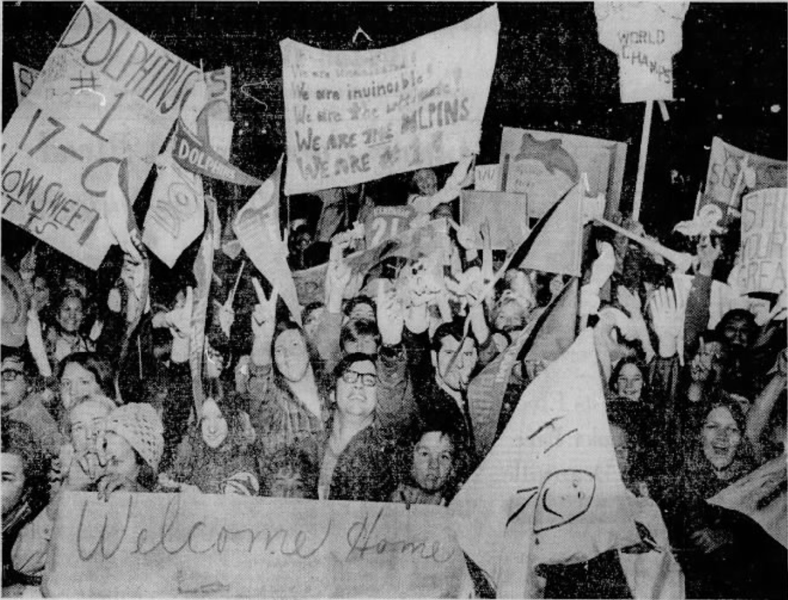 More than 10,000 Miami Dolphins fans welcomed the team back at Miami International Airport following their win in Super Bowl VII to cap their perfect 1972 season.