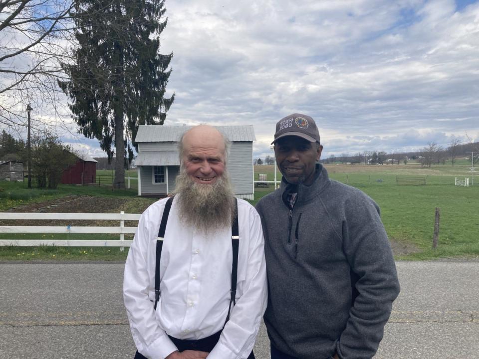 Sam Yoder, the Amish farmer on whose property the former church now sits, poses for a photograph with NAACP Maryland State Conference President Willie Flowers.