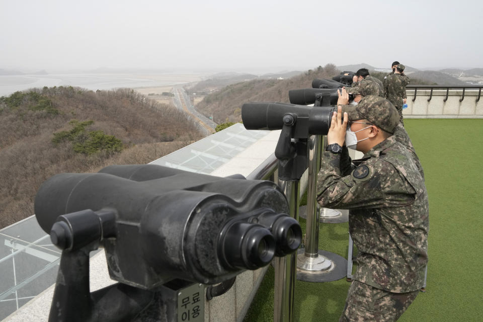 South Korean army soldiers watch the North Korea side from the Unification Observation Post in Paju, South Korea, near the border with North Korea, Friday, March 24, 2023. North Korea said Friday its cruise missile launches this week were part of nuclear attack simulations that also involved a detonation by a purported underwater drone as leader Kim Jong Un vowed to make his rivals "plunge into despair."(AP Photo/Ahn Young-joon)