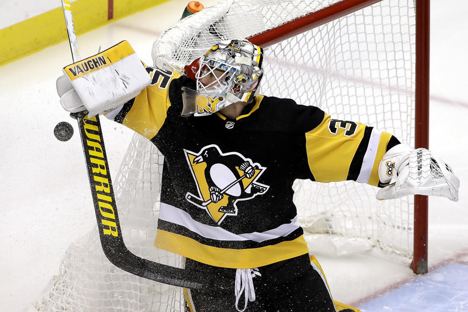 Pittsburgh Penguins goaltender Tristan Jarry stops a shot during the first period of an NHL hockey game against the Montreal Canadiens in Pittsburgh, Tuesday, Dec. 10, 2019. (AP Photo/Gene J. Puskar)