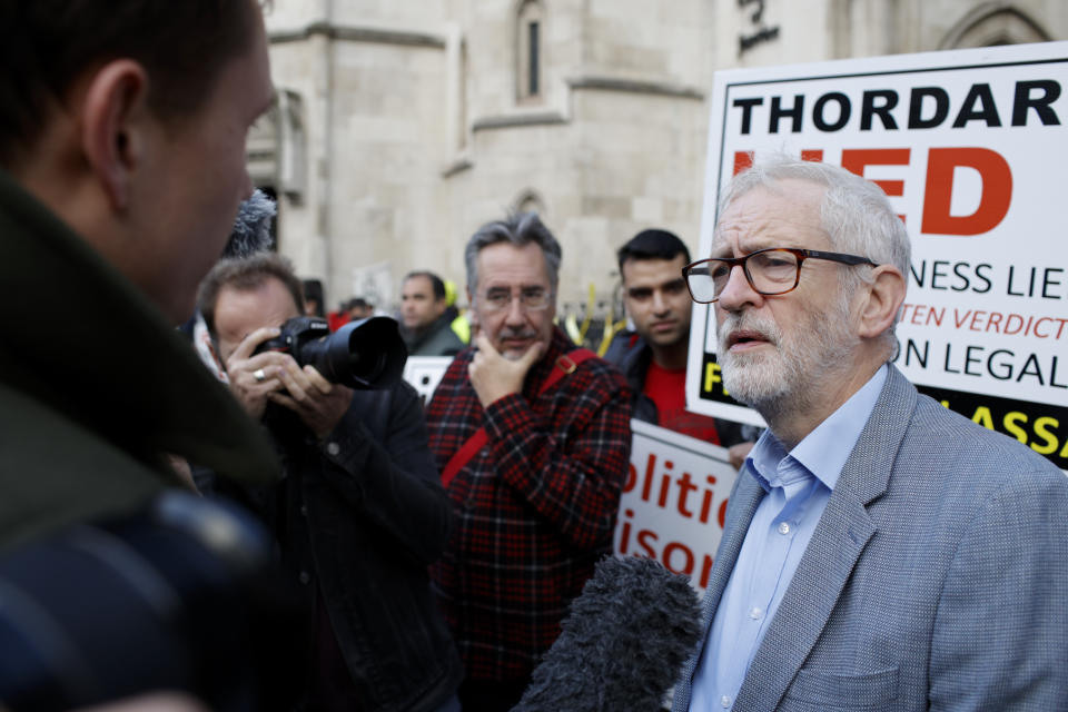 Former British Labour Party leader Jeremy Corbyn speaks to the media after joining Julian Assange supporters outside the High Court in London, Thursday, Oct. 28, 2021. The U.S. government is this week asking Britain's High Court to overturn a judge's decision that WikiLeaks founder Julian Assange should not be sent to the United States to face espionage charges. A lower court judge refused extradition in January on health grounds, saying Assange was likely to kill himself if held under harsh U.S. prison conditions.(AP Photo/David Cliff)