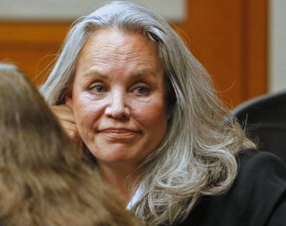 Pamela Phillips looks on in Pima County Superior Court Tuesday, April 8, 2014, in Tucson, Ariz. Phillips, a once-prominent socialite, was found guilty Tuesday of first-degree murder and conspiracy to commit murder in the 1996 Tucson car bomb killing of her ex-husband after spending years abroad living a lavish lifestyle across Europe. (AP Photo/Arizona Daily Star, Ron Medvescek, Pool)