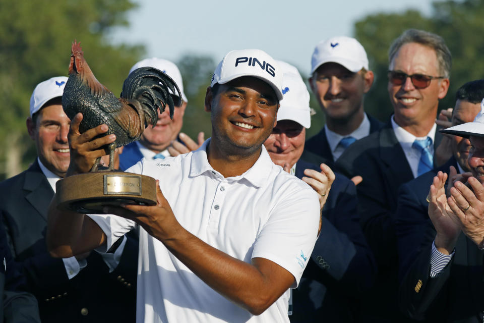 Sebastian Munoz, of Colombia, hoists the trophy after winning the Sanderson Farms Championship golf tournament in Jackson, Miss., Sunday, Sept. 22, 2019. (AP Photo/Rogelio V. Solis)