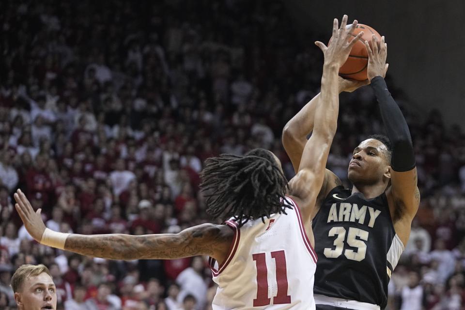Army's TJ Small (35) shoots over Indiana's CJ Gunn (11) during the first half of an NCAA college basketball game, Sunday, Nov. 12, 2023, in Bloomington, Ind. (AP Photo/Darron Cummings)