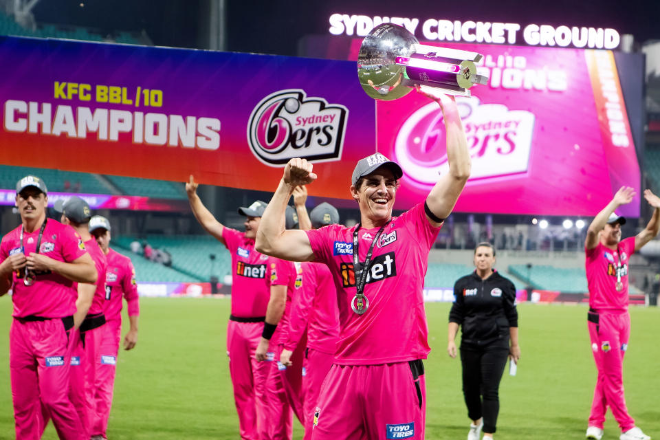 SYDNEY, AUSTRALIA - FEBRUARY 06: Sydney Sixers player Sean Abbott shows off the trophy during the Big Bash League final cricket match between Sydney Sixers and Perth Scorchers at the Sydney Cricket Ground on February 06, 2021 in Sydney, Australia. (Photo by Pete Dovgan/Speed Media/Icon Sportswire via Getty Images)