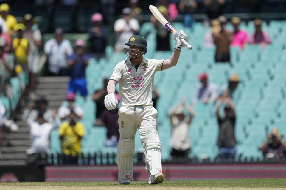 Australia's David Warner raises his bat after making 50 runs against Pakistan on the fourth day of their cricket test match in Sydney, Saturday, Jan. 6, 2024. (AP Photo/Rick Rycroft)