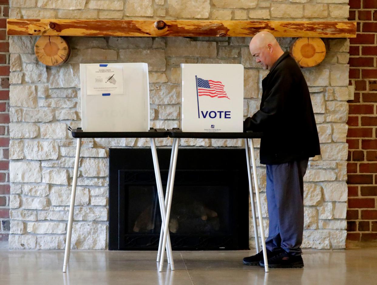 John Schermetzler, of Manitowoc, casts his ballot at the Silver Creek Fieldhouse poll, Tuesday, November 8, 2022, in Manitowoc, Wis.