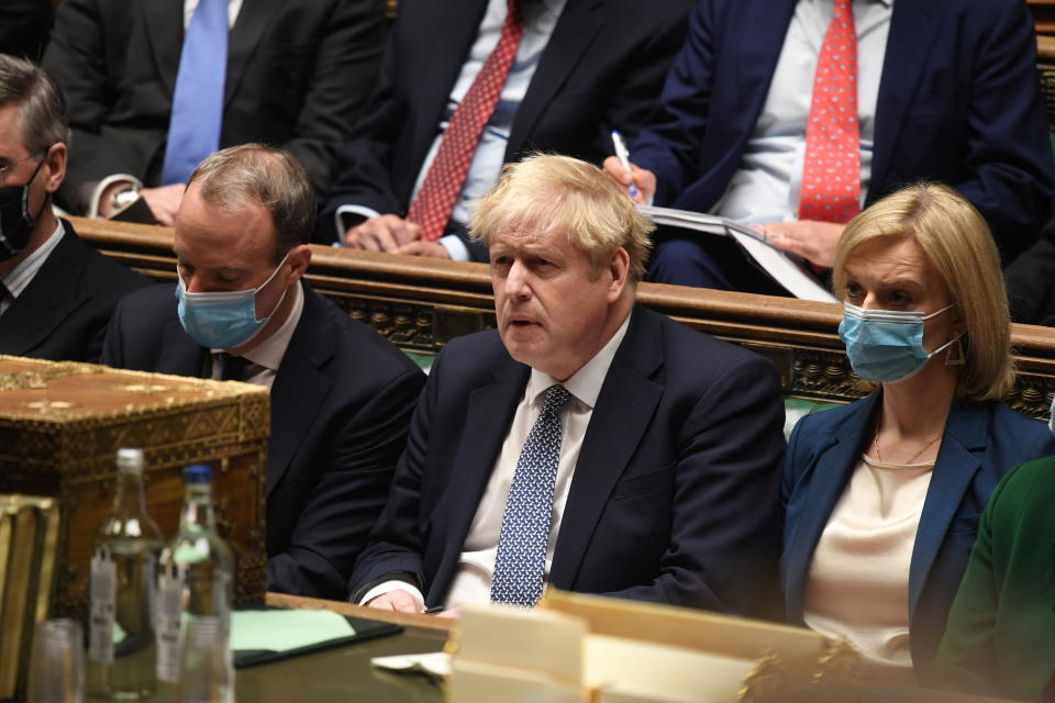 British Prime Minister Boris Johnson attends the weekly Prime Minister's Questions at the parliament in London, Britain, January 12, 2022. UK Parliament/Jessica Taylor/Handout via REUTERS THIS IMAGE HAS BEEN SUPPLIED BY A THIRD PARTY. MANDATORY CREDIT. NO ALTERATIONS