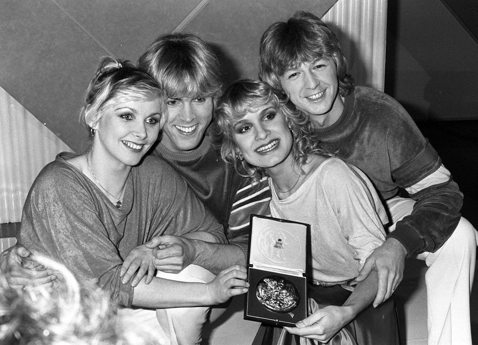 Eurovision winners Bucks Fizz holding a medal