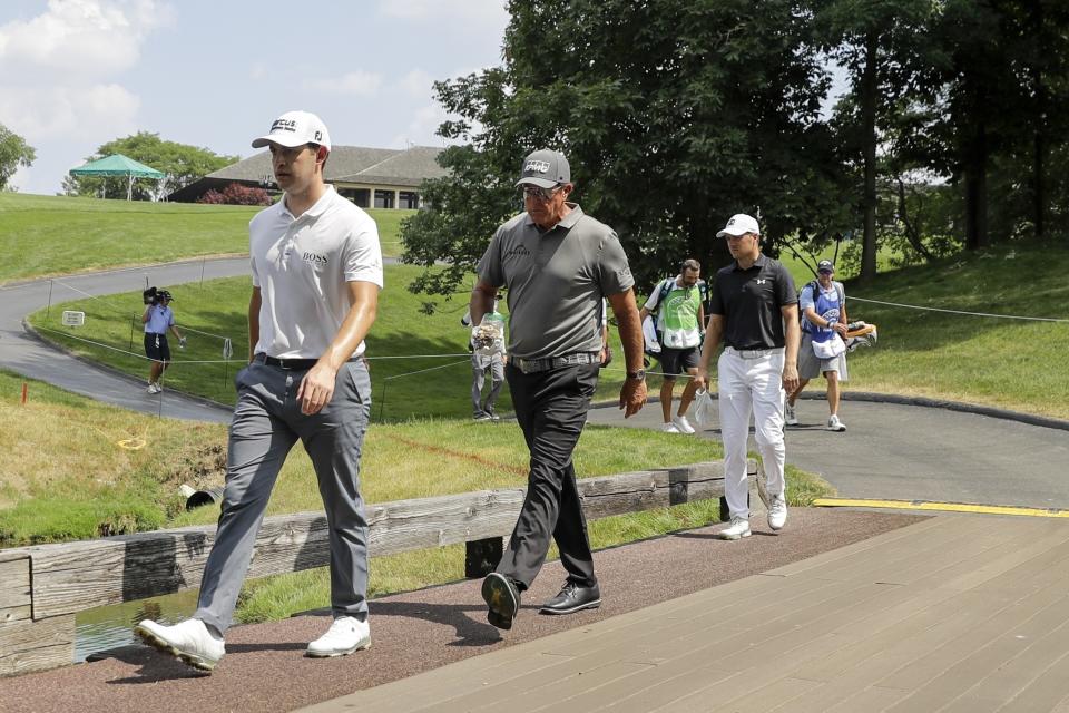 Patrick Cantlay, Phil Mickelson and Jordan Spieth walk to the 10th hole during opening round of the Workday Charity Open golf tournament, Thursday, July 9, 2020, in Dublin, Ohio. (AP Photo/Darron Cummings)