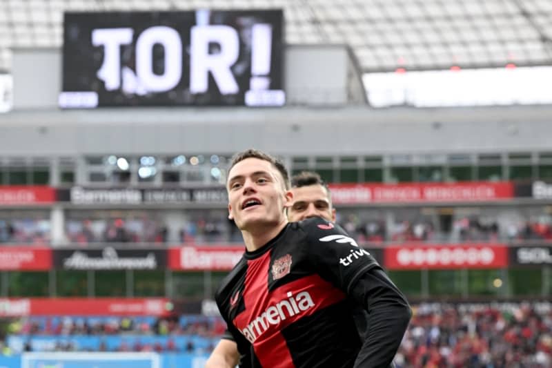 Leverkusen's Florian Wirtz celebrates scoring his side's third goal during the German Bundesliga soccer match between Bayer 04 Leverkusen and SV Werder Bremen at BayArena. Federico Gambarini/dpa