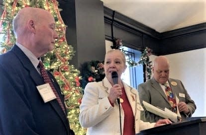 Retired Aurora Fire Chief David Barnes, left, receives the Chamber of Commerce’s citizen of the year award for 2022 from Mayor Ann Womer Benjamin. At right is the Chamber’s Evan Webster.