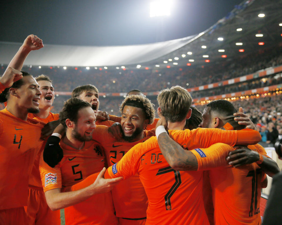 Netherlands players celebrate scoring 2-0 during the international friendly soccer match between The Netherlands and France at De Kuip stadium in Rotterdam, Netherlands, Friday, Nov. 16, 2018. (AP Photo/Peter Dejong)