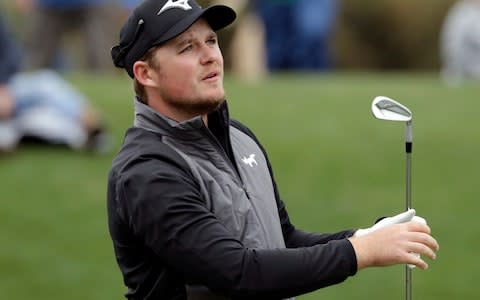 Eddie Pepperell, of England, watches the flight of his tee shot on the third hole during the final round of The Players Championship golf tournament - Credit: Getty Images