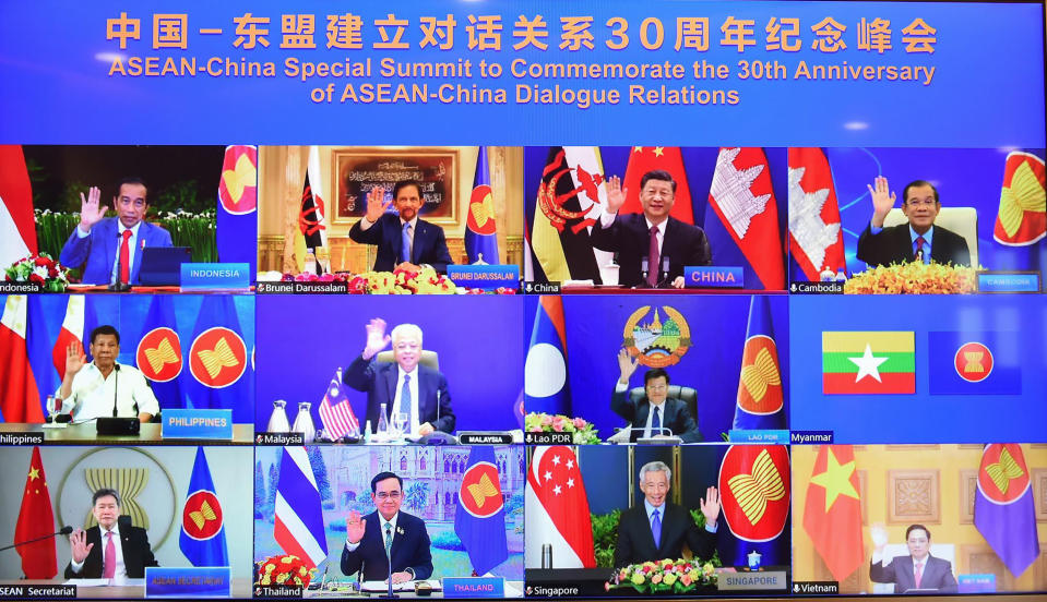 This image provided by Malaysia Prime Minister Office show ASEAN leaders and Chinese President Xi Jinping, top second from right, on screen during an online meeting of the ASEAN-China special summit in Kuala Lumpur, Malaysia, Monday, Nov. 22, 2021. Despite regional frictions, Chinese leader Xi Jinping says his country will not seek dominance over Southeast Asia or bully its smaller neighbors. Xi made the remarks Monday during a virtual conference with the 10 members of the Association of Southeast Asian Nations, known as ASEAN, marking the 30th anniversary of relations between the sides. (Malaysia Prime Minister office via AP)