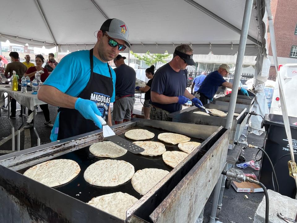 FILE - Volunteers help prepare food at Spring Greek Festival at Holy Trinity Greek Orthodox Church in Augusta on Saturday, April 29, 2023. The festival will return May 10-12.