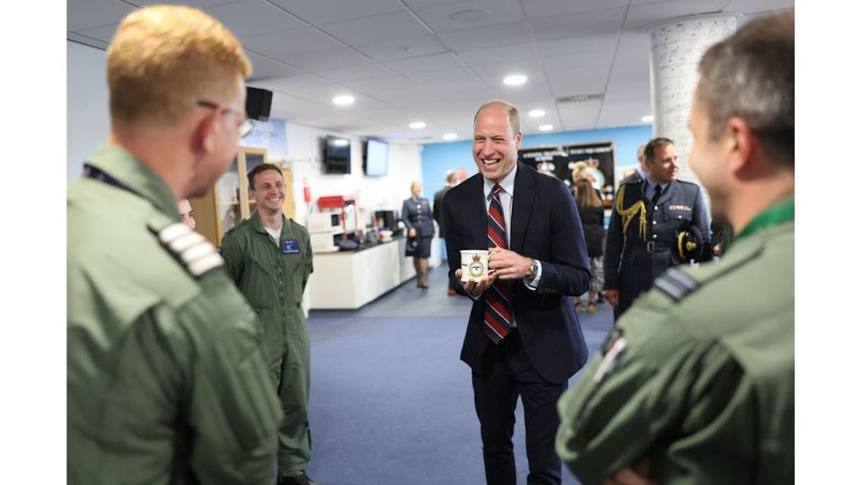 Prince William talks to RAF personnel during an official visit at RAF Valley