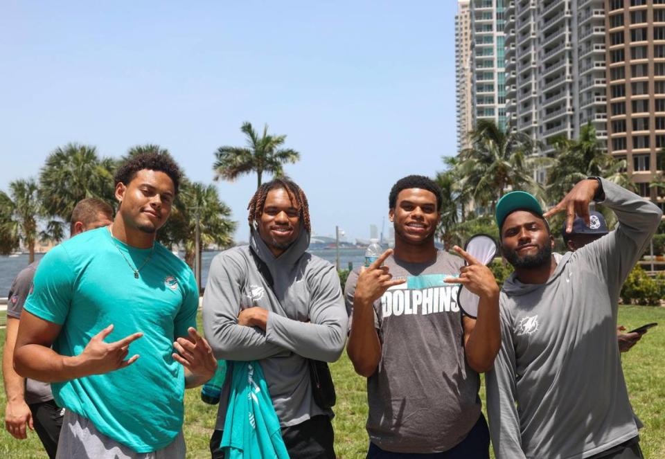 Cameron Goode, signed member of the Miami Dolphins rookie class, left, and Erick Ezukanma, second from the left, pose for a photo with two others during a historic walking tour of Downtown Miami with local community groups on Wednesday, June 15, 2022 beginning with tour leaders at the History Miami Museum. Goode and Ezukanma are two of four players actually signed to the roster for this coming season.