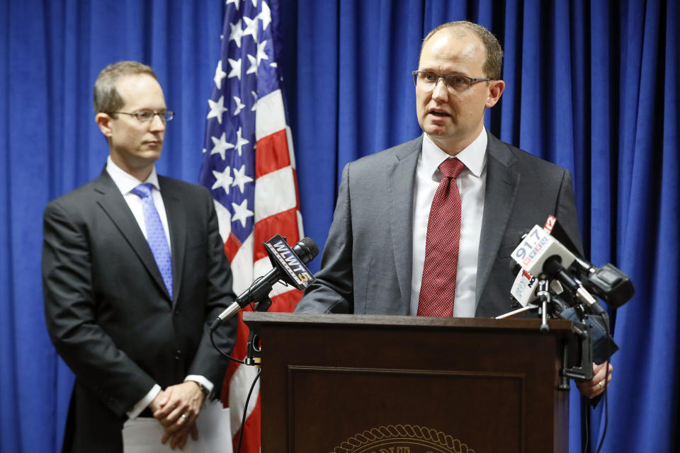 Herb Stapleton, Assistant Special Agent in Charge, FBI, right, speaks alongside U.S. Attorney Benjamin C. Glassman, left, during a news conference, Wednesday, Oct. 10, 2018, in Cincinnati. The Justice Department says a Chinese intelligence operative has been charged with stealing trade secrets from multiple U.S. aviation and aerospace companies. Yanjun Xu was charged Wednesday with conspiring and attempting to commit economic espionage and theft of trade secrets. (AP Photo/John Minchillo)