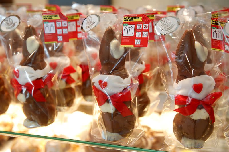 FILE PHOTO: Chocolate Easter bunnies wearing protective masks are seen at Baeckerei Bohnenblust bakery in Bern