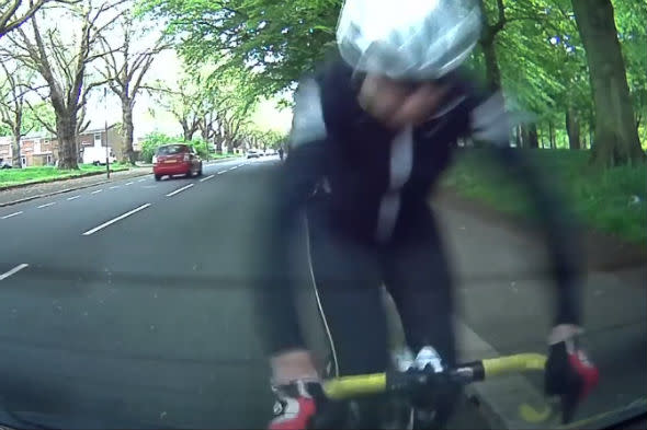 Cyclist crashes into parked car