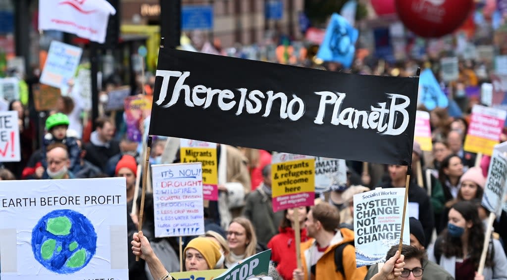 Thousands of protesters demonstrate during a COP26 protest in central London, Britain, 6 November 2021. Protestors are demanding action from world leaders to combat the climate change crisis during the UN Climate Change Conference COP26 taking place in Glasgow. (EPA)