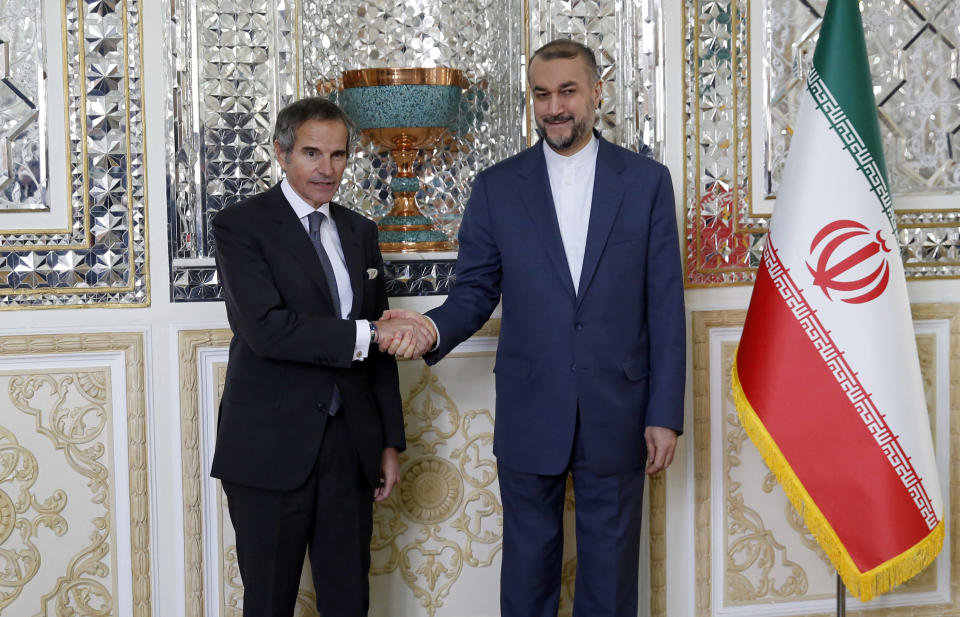 International Atomic Energy Organization, IAEA, Director General Rafael Mariano Grossi, left, and Iranian Foreign Minister Hossein Amirabdollahian pose for the media before their round of talks, in Tehran, Saturday, March 4, 2023. (AP Photo)