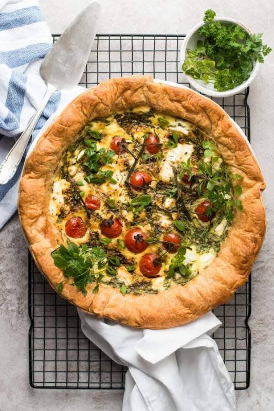<p>Savory Nothings</p><p>This easy tomato spinach feta quiche is made with puff pastry, cheese, eggs and plenty of fresh ingredients.</p><p><strong>Get the recipe: <a href="https://www.savorynothings.com/easy-tomato-spinach-feta-quiche/" rel="nofollow noopener" target="_blank" data-ylk="slk:Easy Tomato Spinach Feta Quiche;elm:context_link;itc:0;sec:content-canvas" class="link rapid-noclick-resp"><em>Easy Tomato Spinach Feta Quiche</em></a></strong></p>