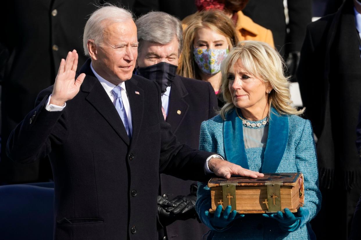 Joe Biden is sworn in as the 46th president of the United States as Jill Biden holds the Bible at the U.S. Capitol on Jan. 20, 2021. (Photo: AP Photo/Andrew Harnik)