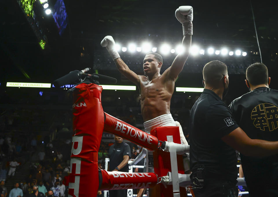 Devin Haney celebrates after defeating Jorge Linares by unanimous decision in the WBC lightweight title boxing match Saturday, May 29, 2021, in Las Vegas. (AP Photo/Chase Stevens)