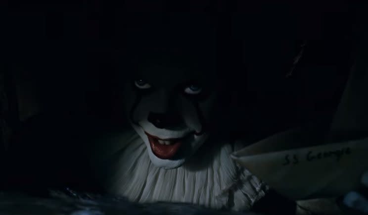 Pennywise lurks in the sewers in new IT trailer - Credit: Warner Bros.