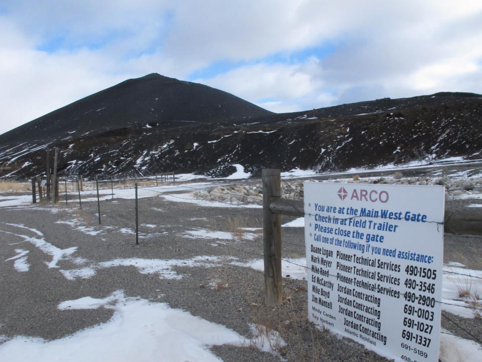 This Dec. 15, 2016 photo shows a slag pile of mining waste in Anaconda, Mont. Environmental regulators have put a halt to a Montana business association’s sale of sandwich bags of mining waste advertised as a “Bag O’Slag.” Environmental Protection Agency officials overseeing the Superfund cleanup of pollution from decades of smelter operations in Anaconda came across the potentially toxic tchotchkes for sale by the city’s chamber of commerce. The slag contains small amounts of arsenic and lead. Mary Johnston, the chamber’s executive director, said Monday, Nov. 18, 2019 the EPA asked them to stop selling the black slag in a re-sealable bag and gave them some alternatives. (AP Photo/Matt Volz)